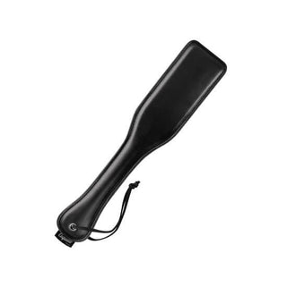 Svart läderpaddel för spanking och BDSM-lekar