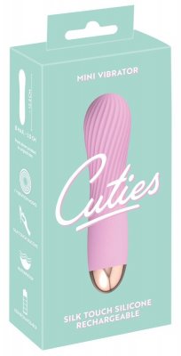 Cuties Mini Vibrator Rosa kommer i en turkos förpackning, med en rosa, texturerad silikondesign med Soft Touch-textur och en slående guldaccent, som kombinerar elegans med funktionalitet.