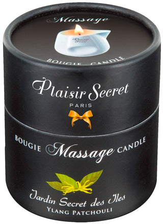 En svart cylindrisk behållare, märkt Plaisir Secret Massageljus och Jardin Secret des Iles, har en liten bladbild som påminner om en keramisk burk.