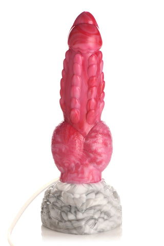 Resurrector Squirting Dildo har ett rosa, texturerat silikonskaft med en vit och grå marmorerad bas och sugkopp, som visas stående upprätt mot en vit bakgrund.