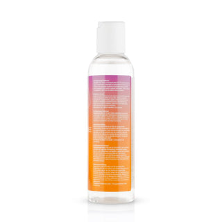 Baksidan av en Easyglide Glycerine Free - 150 ml flaska, med en transparent design med ett vitt lock och en orange-lila gradientetikett täckt med text som framhäver dess vattenbaserat glidmedel för långvarig glidförmåga.