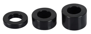 Penisring - Rebel MBS Ball Stretching Kit har tre svarta, cylindriska, ihåliga ringar av varierande höjd arrangerade i rad på en vit bakgrund, perfekt balanserar konsten att form och funktion.
