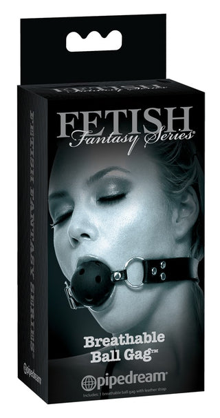 En låda med en kvinna som bär Svart Ballgag med Luftkanaler från Fetish Fantasy Series av Pipedream, perfekt för de som utforskar BDSM-lekar.