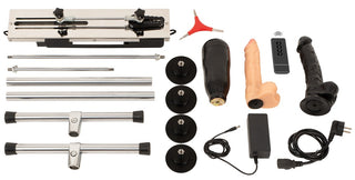 Dubbelsidig sexmaskin med metallram, sugkoppar, fjärrkontroll, tillbehör och två silikon-dildos.