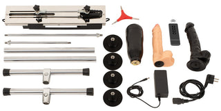 Dubbelsidig sexmaskin med metallram, sugkoppar, fjärrkontroll, tillbehör och två silikon-dildos.