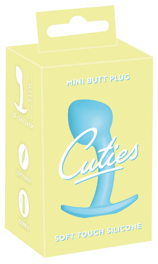 Cuties Mini Buttplug Blå kommer i en gul låda, som visar upp en blå silikonplugg känd för sin mjuka touch och flexibilitet. Tillverkad av kroppssäkert silikon, passar den perfekt med vattenbaserat glidmedel för ökad komfort.