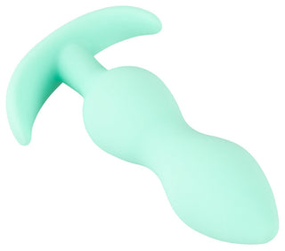 Cuties Mini Buttplug Grön är en mintgrön, tre-lagers plugg tillverkad av kroppssäkert silikon, med ett T-format handtag för komfort och lätthet.