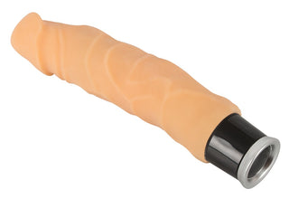 En hudfärgad dildovibrator med svart fot, tillverkad av Nature Skin-material, avbildad mot en vit bakgrund.