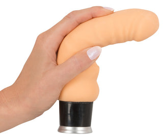 Nature Skin Big Vibe 18 cm, en hudfärgad, böjd och flexibel vibrator med en svart och silverfärgad bas.