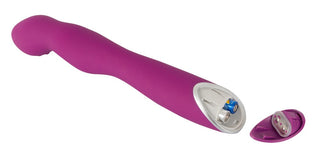 Sweet Smile - A & G-Punkts Vibrator är en lila, batteridriven massageapparat med ett avtagbart lock som avslöjar batterifacket och erbjuder 7 vibrationer för olika förnimmelser.