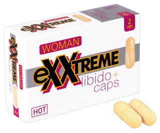 Förpackning med eXXtreme Libido Caps Woman kosttillskott med två gula kapslar; förpackningen är rektangulär och har produktmärke.