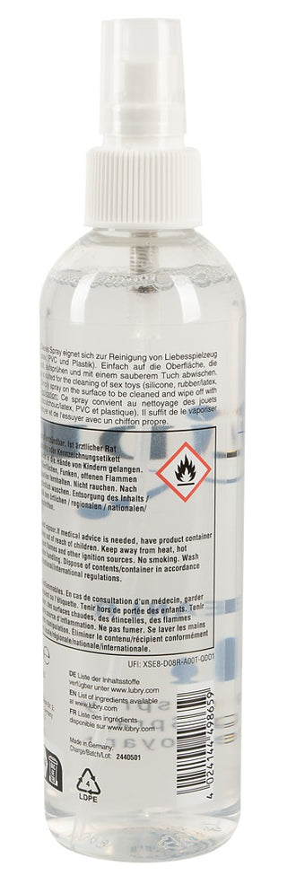 Just Glide Rengöringsspray 250ml levereras i en klar sprayflaska med en brandvarningsetikett och flerspråkiga instruktioner - perfekt för rengöring av hudvänliga produkter tack vare sin alkoholbaserade formula.