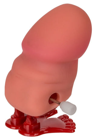 Rolig Vandrande Willy är en rosa, tungformad upprullningsleksak med små röda fötter och en metallisk sidonyckel. Den har en slät konsistens och står upprätt, vilket ger kul till alla festdekorationer.