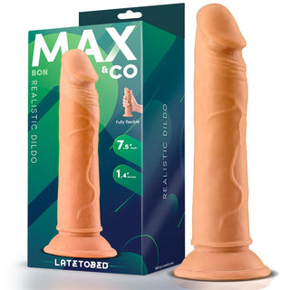 Svart silikondildo, 19 cm lång med sugkopp, står upprätt bredvid förpackningen.