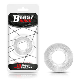 Förpackningen för Beast Flexibel Cockring har en tydlig, strukturerad penisring märkt "19 Striped Cock Ring", med en modern design – vit bakgrund och mörkt webbliknande mönster – som lovar förbättrad erektion och ökad uthållighet.