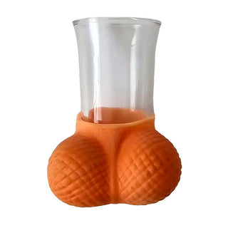 Ett roligt snapsglas, Kul Shotglas med Pung, med en orange, strukturerad rund bas som ser ut som två valnötter – perfekt för fester eller svensexor.