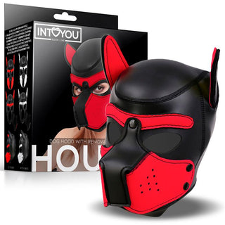 Pup Play Hundmask Neopren, en svart och röd mask med öron som är idealisk för valplek, visas här framför sin förpackningslåda.