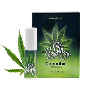En låda och en liten flaska med OH Holy Mary The Original Pleasure Oil, båda med grön och vit förpackning.