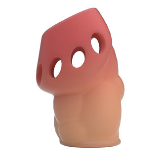 Rosa och beige TPR-penishylsa med cirkulära hål och geometrisk design.