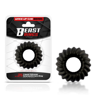 En svart sågtandsring av silikon och dess förpackning visas. Förpackningen visar tydligt "Beast Liquid Silicone Penisring" och "25 Liquid Silicone Sawtooth Cock Ring." Den har en strukturerad exteriör som erbjuder en flexibel och hållbar design mot en vit bakgrund med röda accenter.