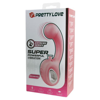 En rosa dubbelvibrator i silikon med böjd design och integrerad klitorisstimulator, visad i sin produktförpackning.