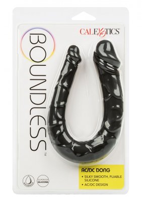 Boundless AC/DC Dong är en svart U-formad dubbeldong i silikon, elegant inkapslad i klar förpackning med Boundless branding och produktbeskrivning.