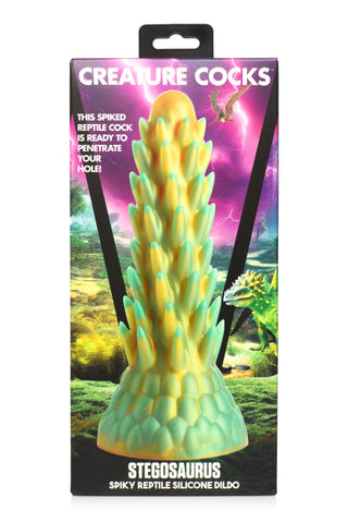 Låda för Stegosaurus Dildo Silikon med en spikad design av Creature Cocks med en reptilbakgrund - en perfekt fantasileksak för dinosaurieälskare.