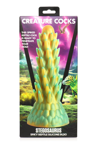 Låda för Stegosaurus Dildo Silikon med en spikad design av Creature Cocks med en reptilbakgrund - en perfekt fantasileksak för dinosaurieälskare.