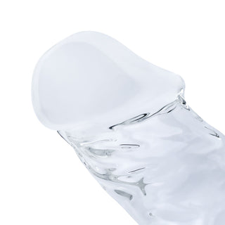 Genomskinlig glasdildo, 18 cm lång, med en slät, rundad spets och en enkel cylindrisk form.