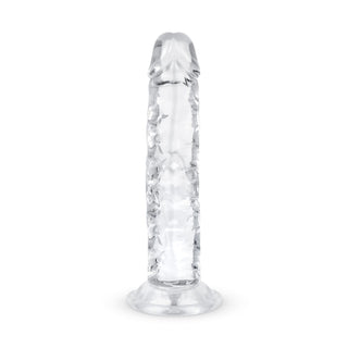 Jelly Dildo 14 cm Utan Pung är en realistisk, genomskinlig leksak som står upprätt på en platt bas och kombinerar elegans med verklighetstrogna detaljer.