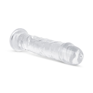 Transparent Jellydildo 20 cm har en realistisk, strukturerad design i genomskinlig gelé för en verklighetstrogen känsla och ett elegant utseende - perfekt för dem som vill ha både stil och känsla. Fotograferad på en vit bakgrund.
