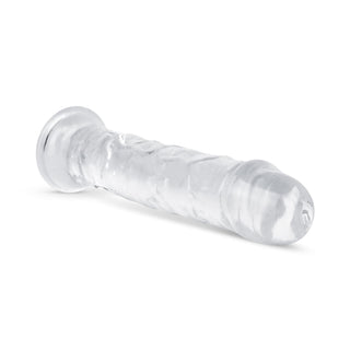Transparent Jellydildo 20 cm har en realistisk, strukturerad design i genomskinlig gelé för en verklighetstrogen känsla och ett elegant utseende - perfekt för dem som vill ha både stil och känsla. Fotograferad på en vit bakgrund.