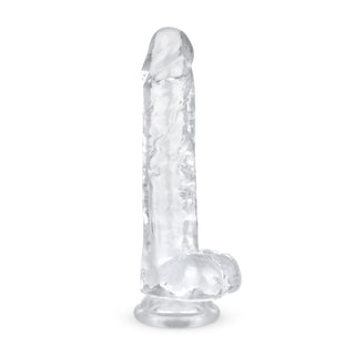 Jelly Dildo 19 cm Med Pung har en tydlig, realistisk design med en stark sugbas. Den är perfekt för vaginal och anal stimulering och står upprätt på en vit bakgrund.
