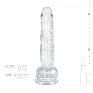 Jelly Dildo 19 cm Med Pung är en transparent, texturerad dildo som är idealisk för vaginal och anal stimulering, avbildad bredvid ett läppstift för storleksreferens.