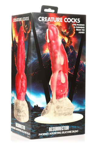 Ask som visar en röd och vit Resurrector Squirting Dildo med sugkopp, inspirerad av en eldig fenixdesign och med en texturerad silikonyta för förbättrad känsla.