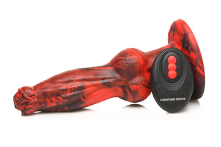 Hel-Wolf Thrusting Dildo är en röd och svart fantasileksak tillverkad av kroppssäkrar kisel, med en fjärrkontroll märkt CREATURE COCKS, som visas mot en vit bakgrund.