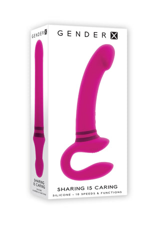 Låda med en rosa Evolved Novelties Strapless Strapon tillverkad av kroppssäkert silikon, med dubbla motorer och 10 hastigheter/funktioner; märkt Gender X - Sharing is Caring.