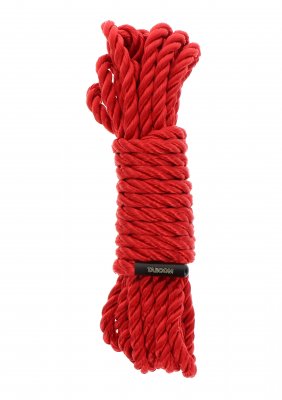 En hoprullad bunt TabooM Bondage Rep - 5m, som föreställer exklusivt hantverk, fästs med ett svart band mot en skarp vit bakgrund.