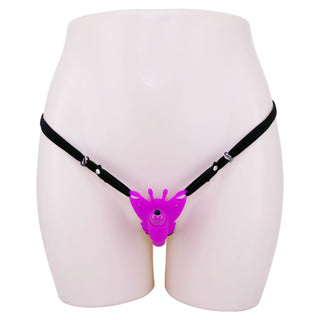 Skyltdocka iförd en svart sele med Pretty Love Fjärilsvibrator fäst vid bäckenet för riktad stimulering.