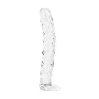 Genomskinlig, strukturerad glasdildo, 19 cm lång, står upprätt mot en vit bakgrund.