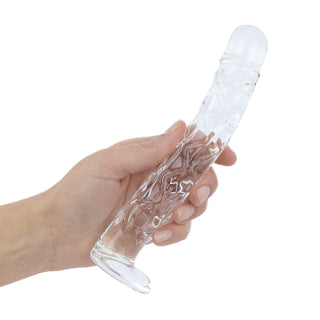 Ribbad dildo i klart glas, cylindrisk med en rundad ände, 19 cm lång.