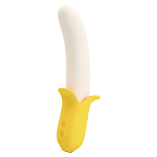 Gul och vit silikonvibrator med bananform och två kontrollknappar på handtaget.