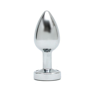 Rimba Buttplug Med LED, med sin glänsande metalliska finish, avsmalnande topp, smala skaft och platta bas, står upprätt mot en vit bakgrund som glittrar som en LED-ljus i rampljuset.