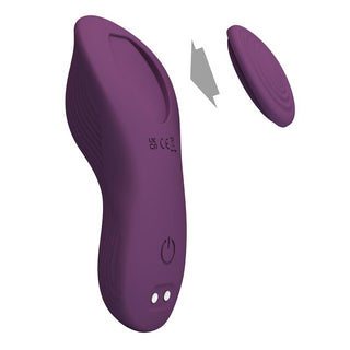 Appstyrd trosvibrator i lila silikon med löstagbar laddare, strömknapp och indikatorlampor.
