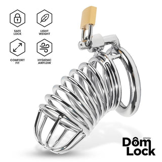 Domlock Warden Penisbur Metall S kyskhetsbur i lättviktsmetall, silverfärgad, med luftflödeshål och ergonomisk design.