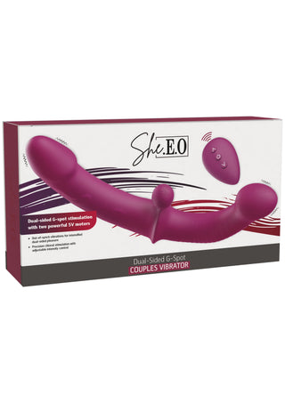 Lila, dubbelsidig G-punktsvibrator i silikon med fjärrkontroll, presenterad i sin försäljningsförpackning.