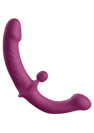 Lila, dubbelsidig G-punktsvibrator i silikon med böjd form och strukturerad bas mot en vit bakgrund.