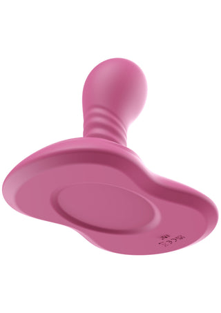 En rosa napp i silikon med en rund nappspets bredvid en vit ”She E.O Rotating Vibrating Grinder” mot en enfärgad bakgrund.