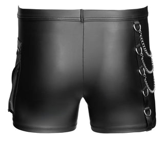 NEK Pants Matt Svart: svarta matta byxor med kedjedetaljer och metallringar på höger sida, med en tight passform, visade bakifrån.