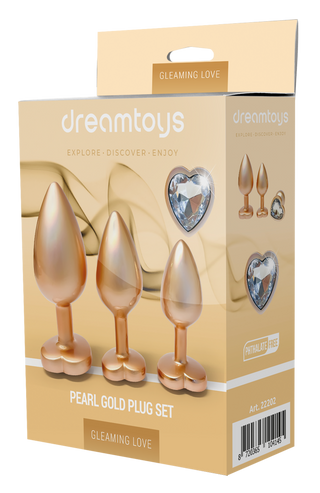 En låda märkt "Pärlguld Buttplug Set 3-pack" visar bilder av tre pärlguld buttpluggar med hjärtformade ädelstenar, som framhäver detta eleganta set.